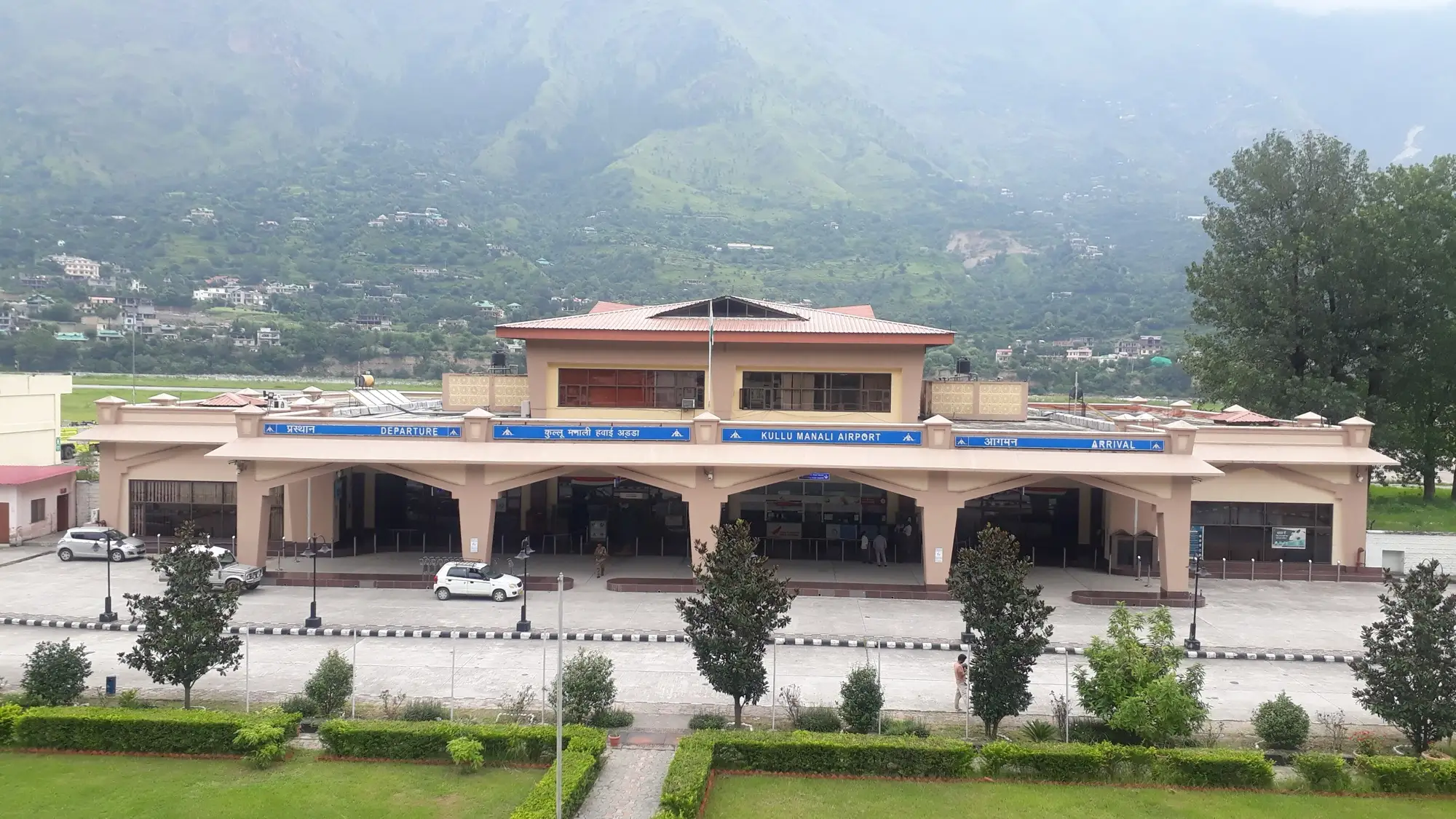 The terminal building of Kullu Manali airport at Bhuntar, with hills behind