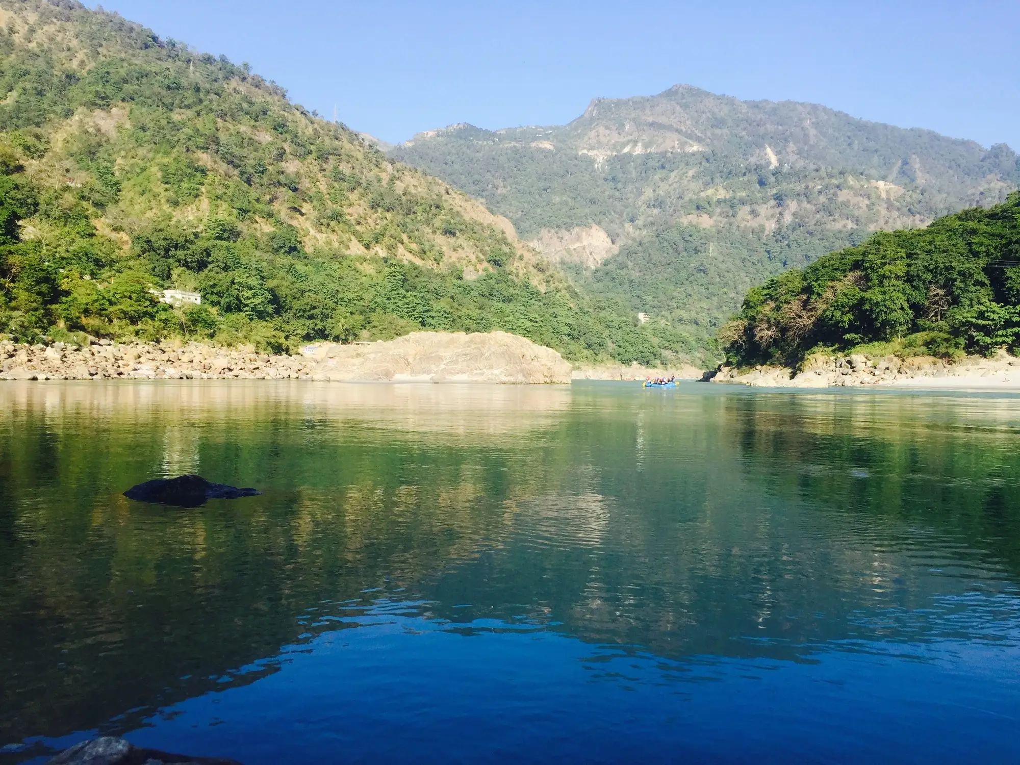 Clear water and smooth boulders on the Ganga at Rishikesh