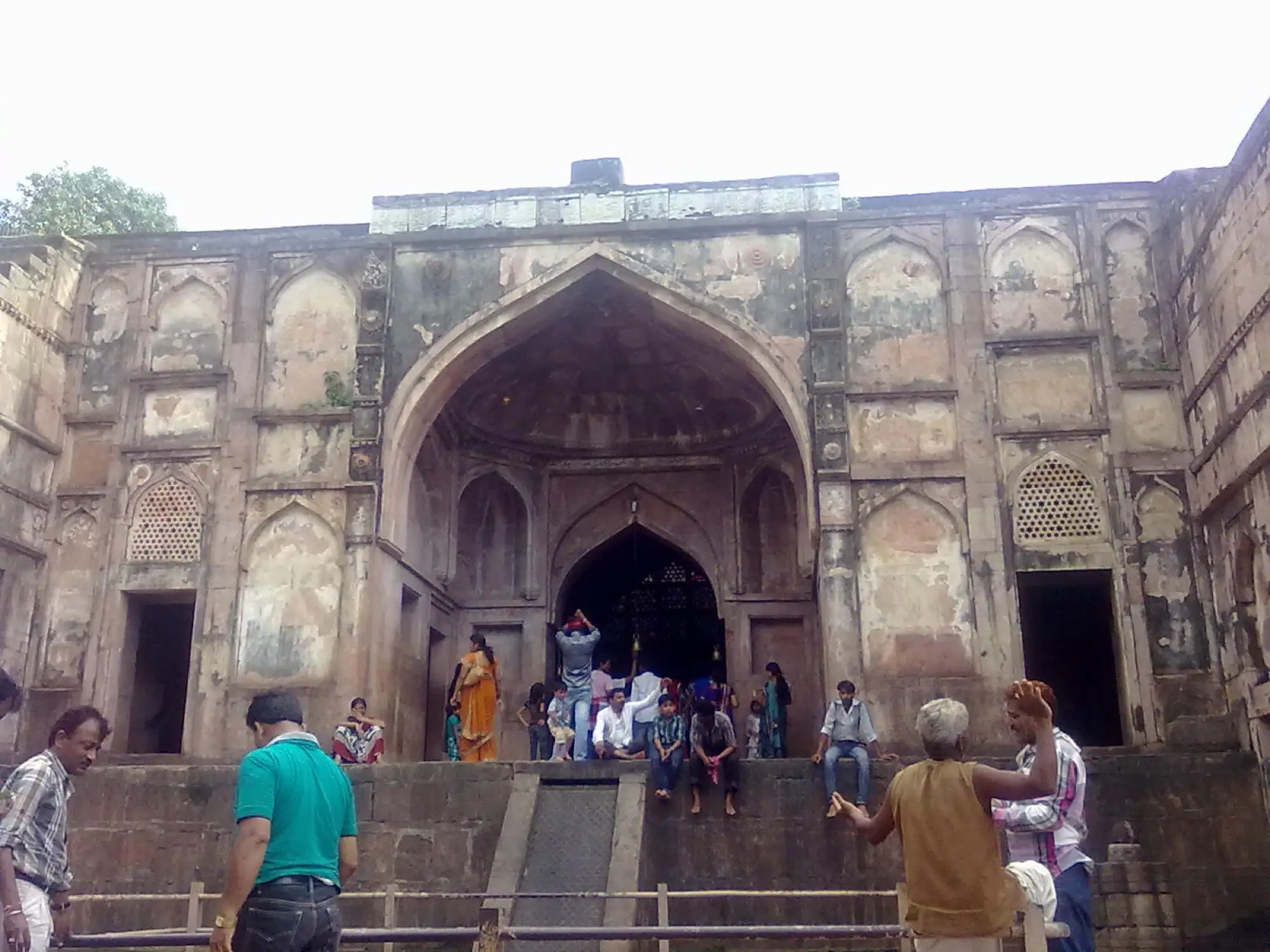The entrance to the Neelkanth Mahadev temple, with visitors at the gate