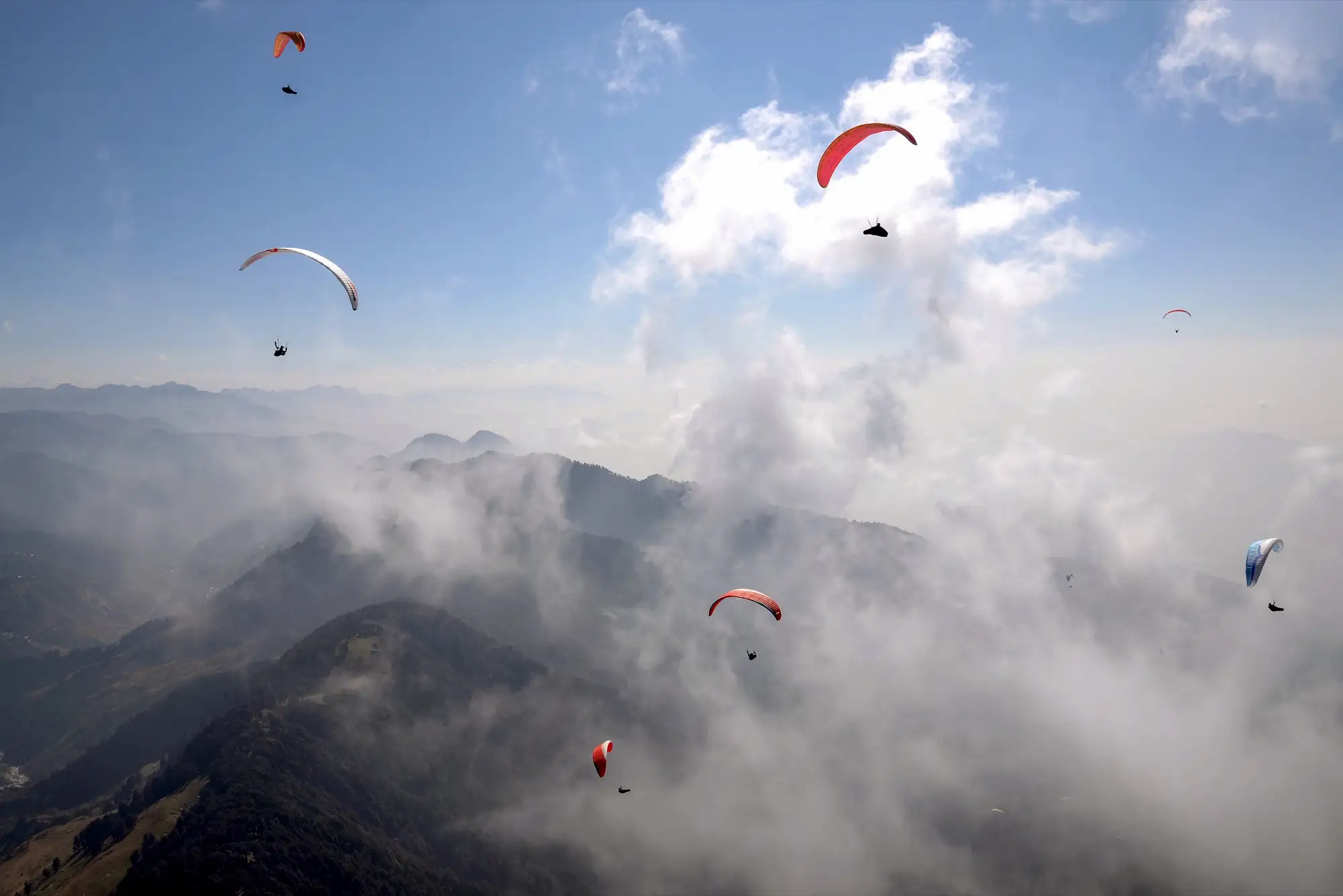 Paragliders over the hills above Bir